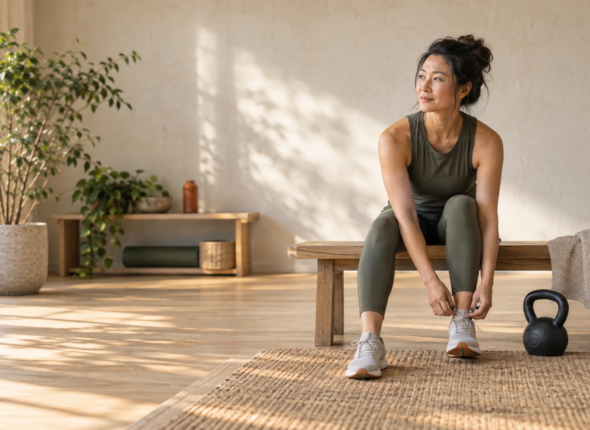 A woman pausing to assess how she feels after an intense workout